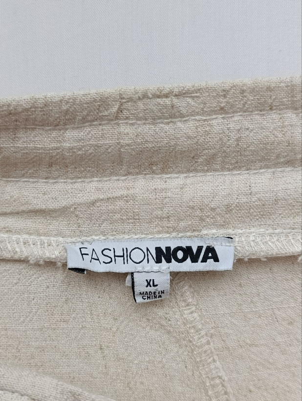 شلوار زنانه لینن برند FASHION NOVA استوک اورجینال رنگ کرم نمای اتیکت و برند