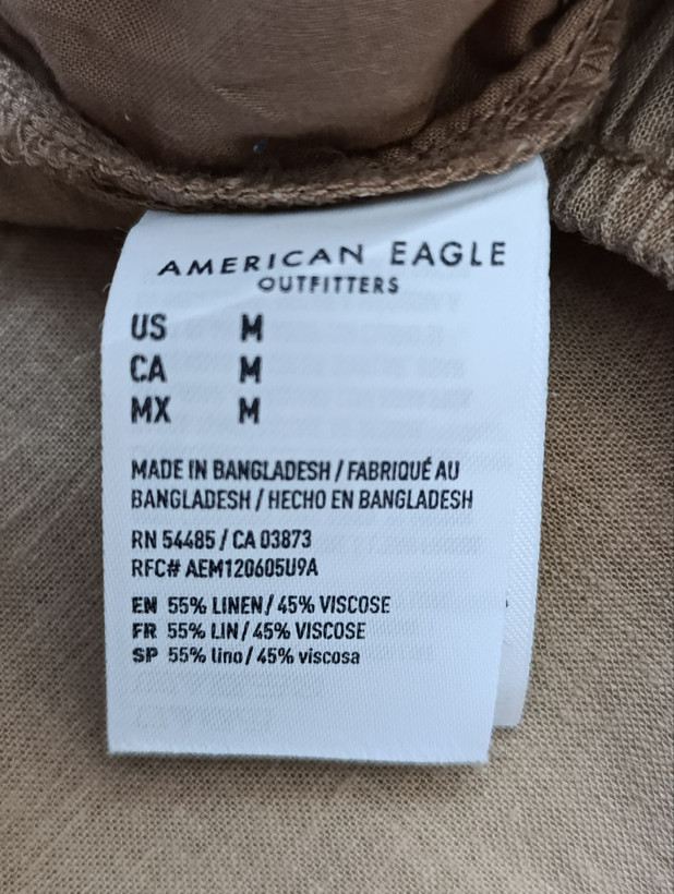 شلوار زنانه لینن برند AMERICAN EAGLE استوک اورجینال رنگ قهوه ای نمای اتیکت