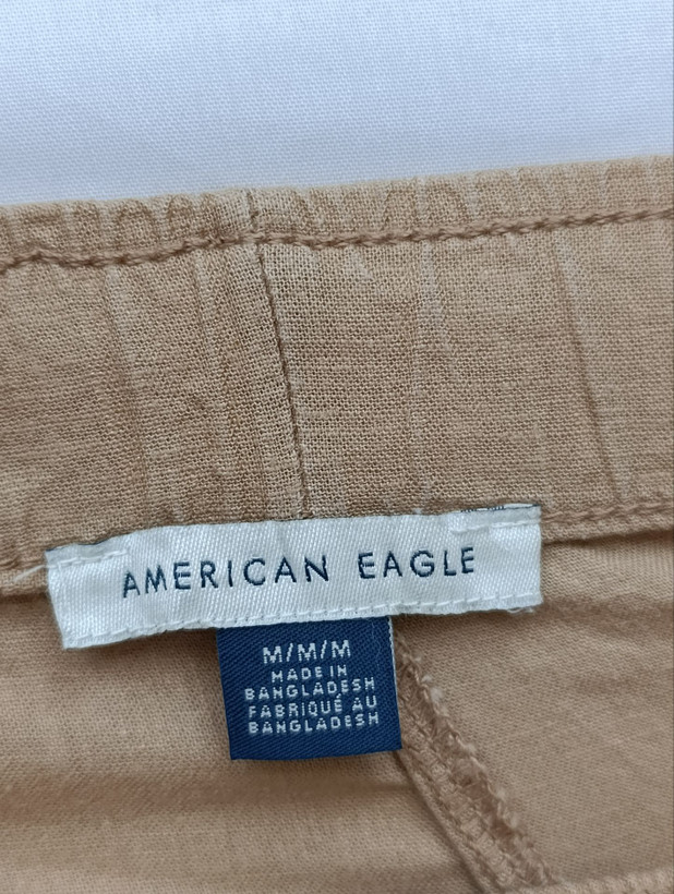 شلوار زنانه لینن برند AMERICAN EAGLE استوک اورجینال رنگ قهوه ای نمای اتیکت و برند