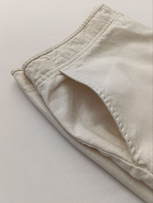 شلوار زنانه لینن برند DOCKERS استوک اورجینال رنگ شیری نمای جیب