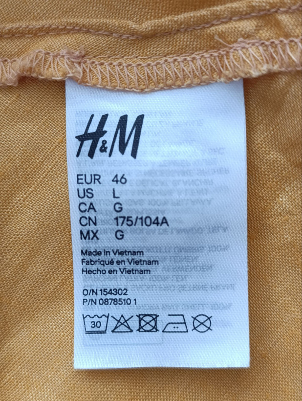 تاپ زنانه لینن برند H&M استوک اورجینال رنگ نارنجی نمای اتیکت