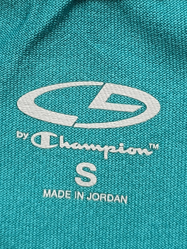 لباس ورزشی برند BY CHAMPION استوک اورجینال رنگ فیروزه ای نمای لوگو و برند