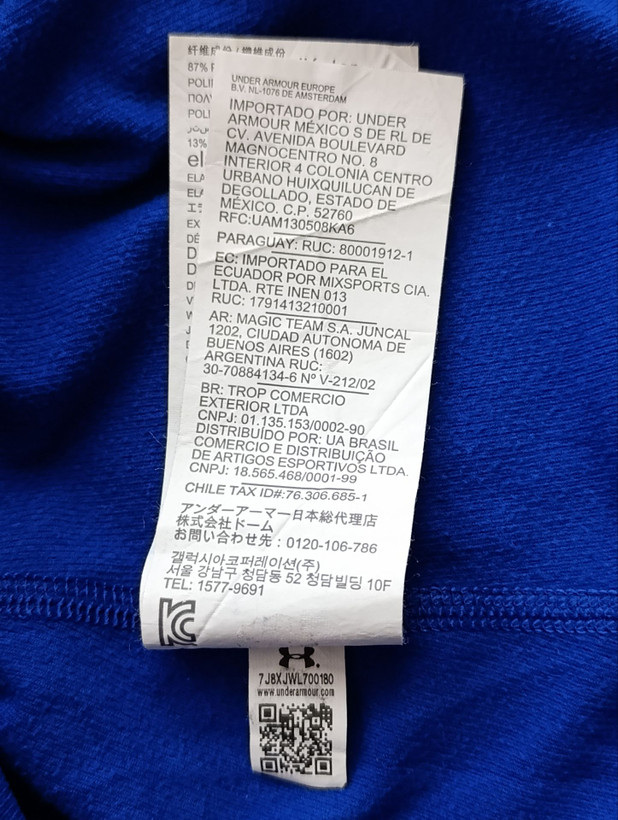 لباس ورزشی زنانه برند UNDER ARMOUR استوک اورجینال رنگ آبی نمای اتیکت مشخصات