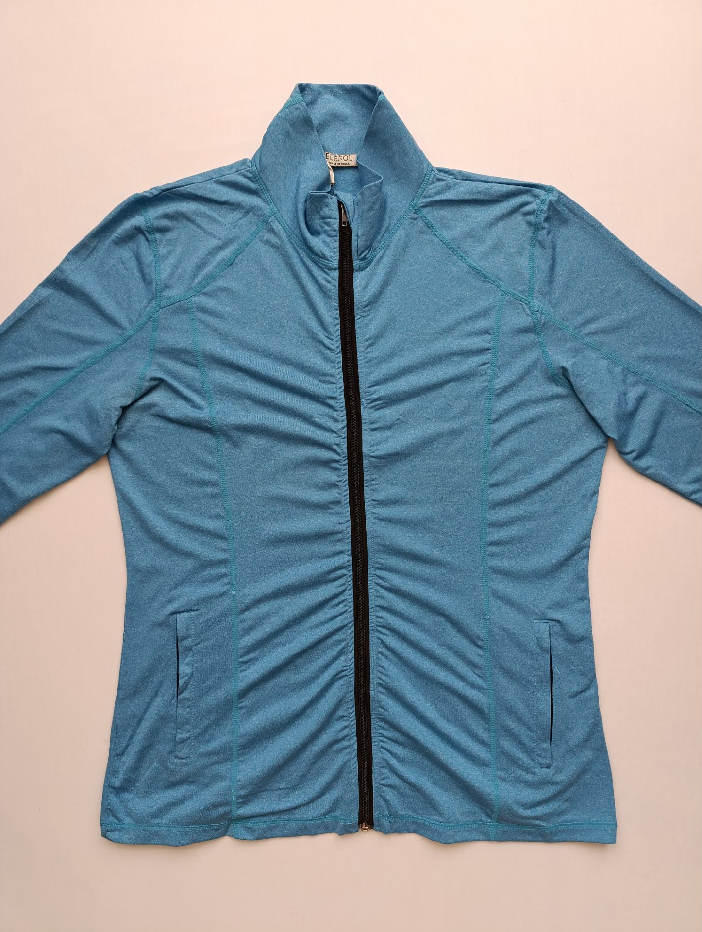 لباس ورزشی زنانه برند ELESOL استوک اورجینال رنگ فیروزه ای نمای جلو