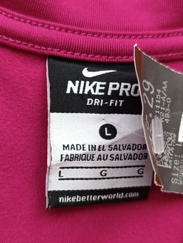 نیم زیپ ورزشی زنانه برند NIKE استوک اورجینال رنگ سرخابی نمای اتیکت برند